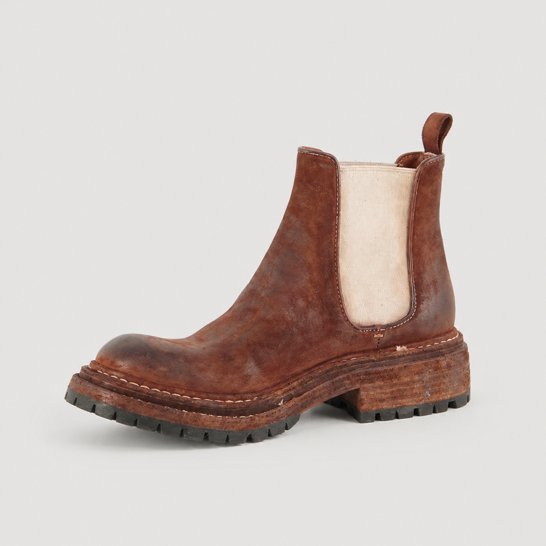 Textured Shell Cordovan Chelsea boot on a light gray background